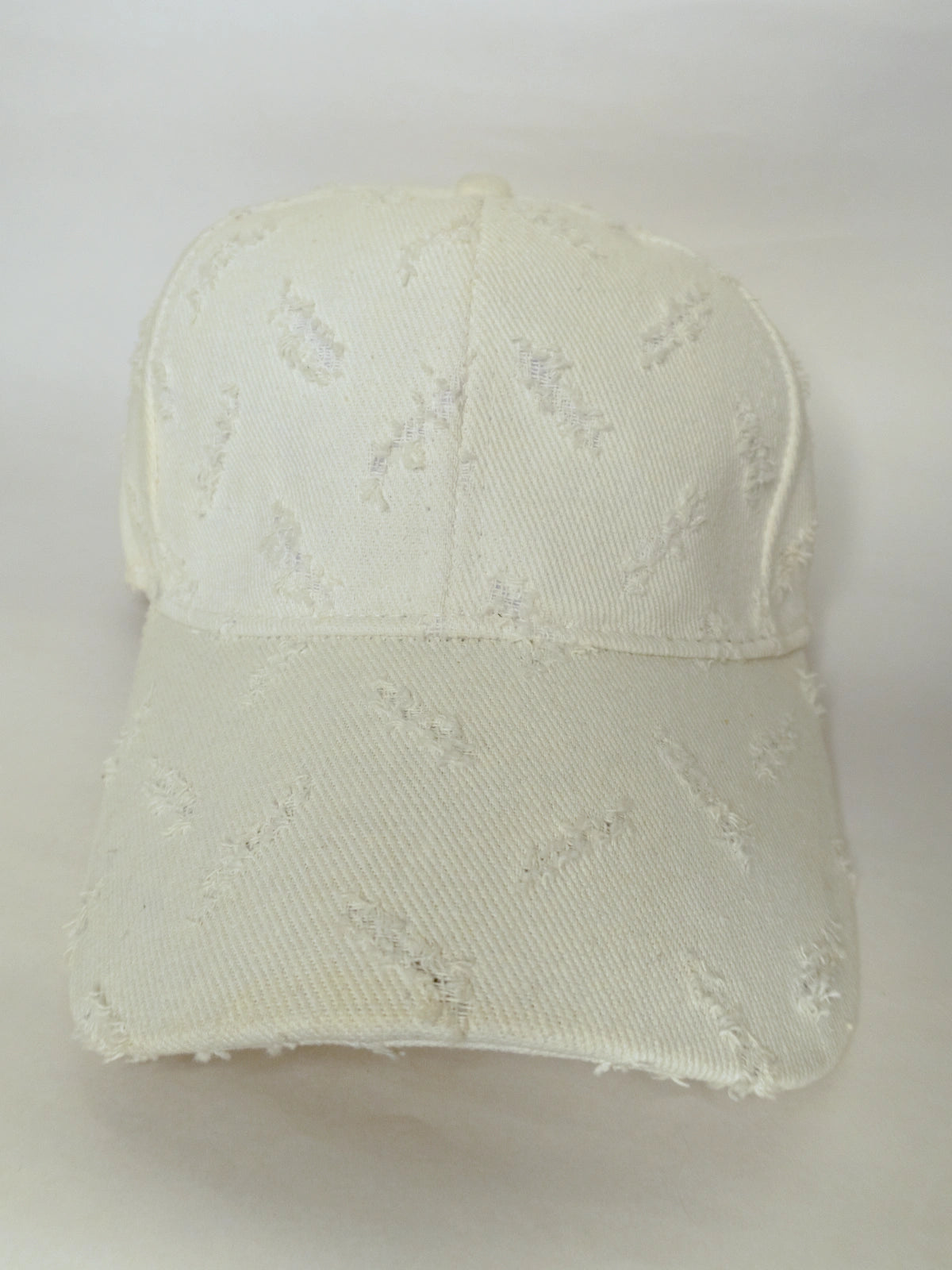 White distressed baseball cap on a white background