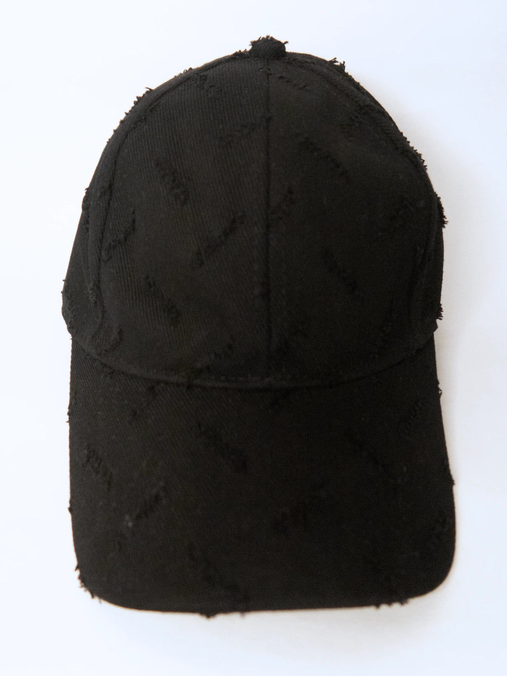 Black distressed baseball cap on a white background