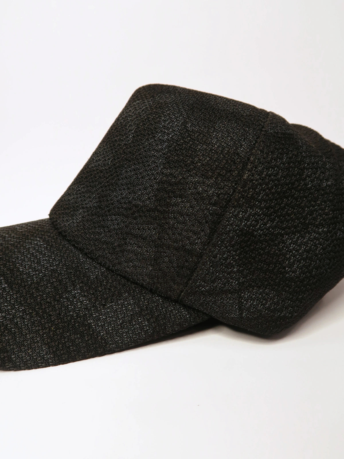 Black textured cap on a white background