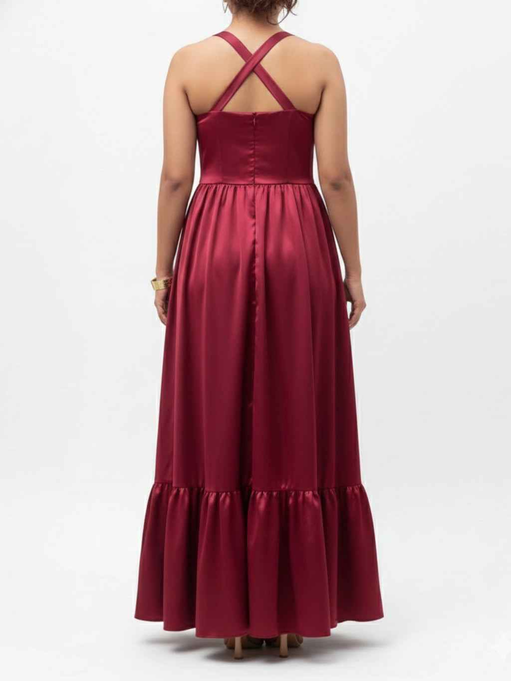 Red evening gown with a cross-back design on a white background