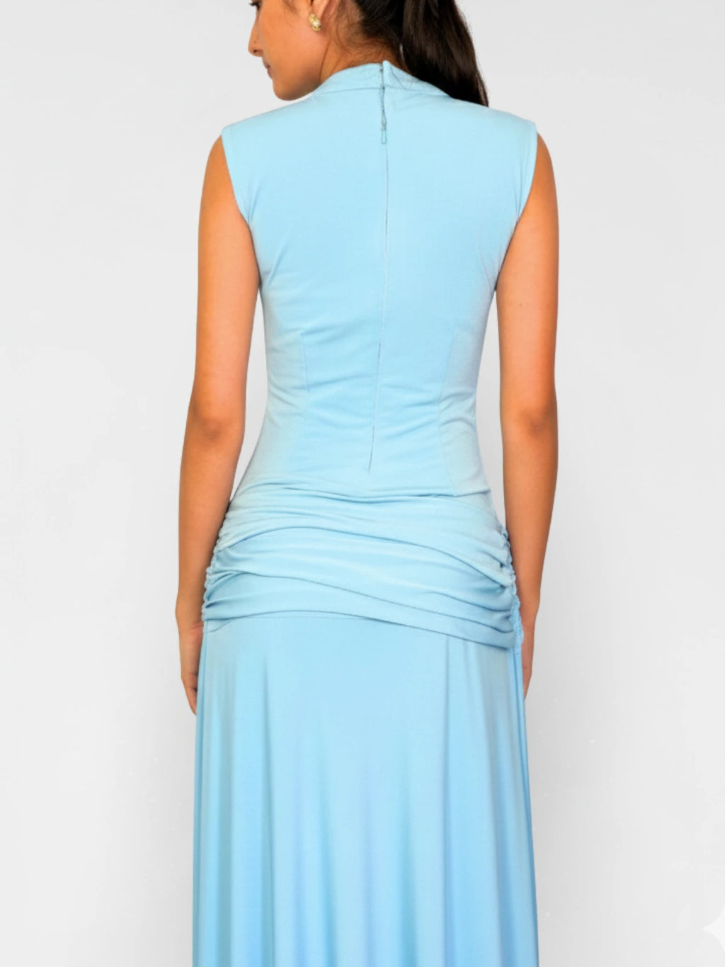 Light blue dress worn by a person on a white background