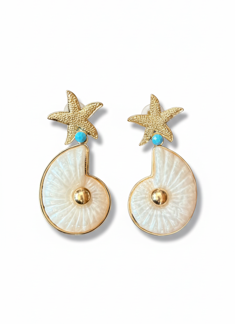 Pair of earrings with starfish and shell design on a white background