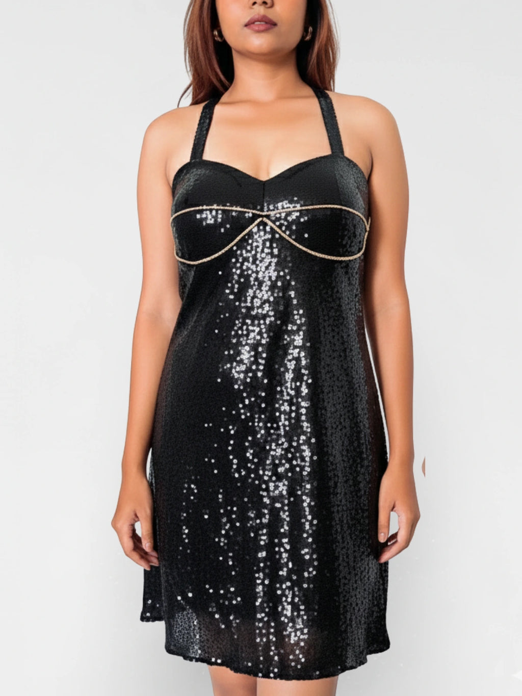 Black sequin dress with gold trim worn by a model on a white background